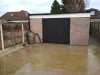 Garage from back yard with doors closed